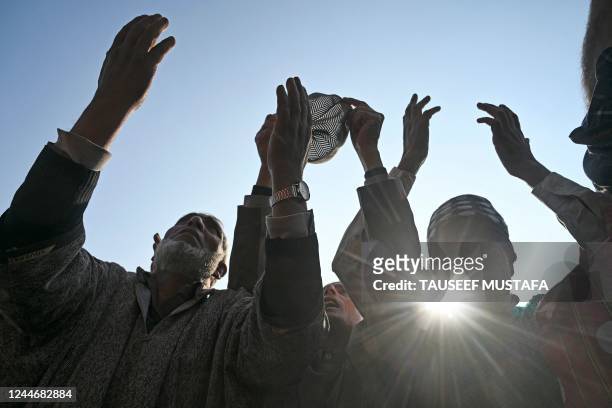 Muslim devotees pray as a priest displays a relic marking the last friday of 'urs', or death anniversary of the sufi saint who lived in Baghdad some...