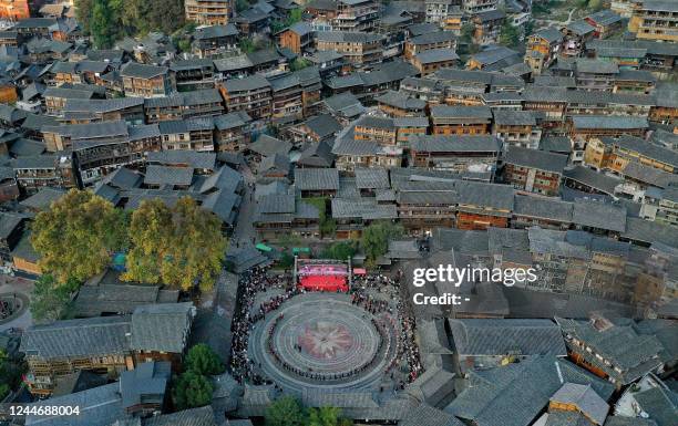 This aerial photo shows local people taking part in the celebration of the Kuzang festival in Leishan county, in China's southwestern Guizhou...