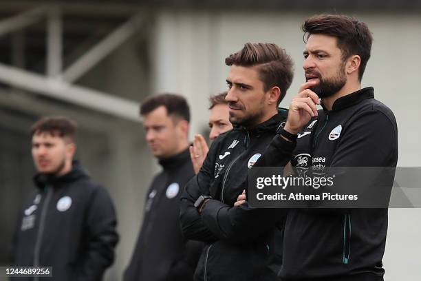 Head of Physical Performance Matt Willmott and Swansea City manager Russell Martin observe the players as they train during the Swansea City Training...