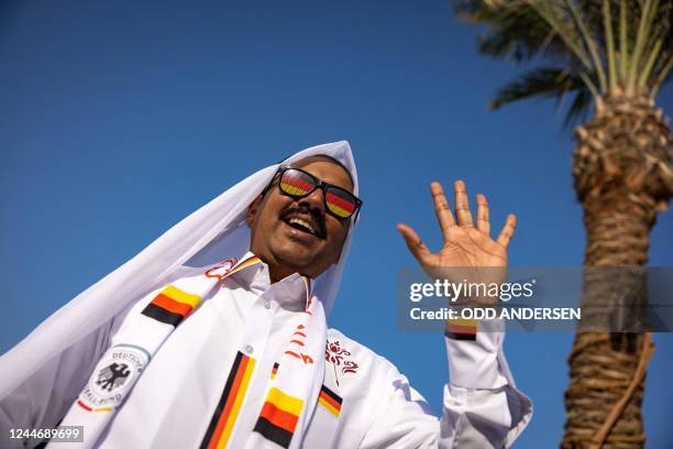 Football fan supporting Germany cheers in Doha on November 11 ahead of the Qatar 2022 FIFA World Cup football tournament.