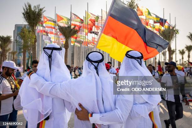 Football fans supporting Germany cheer in Doha on November 11 ahead of the Qatar 2022 FIFA World Cup football tournament.
