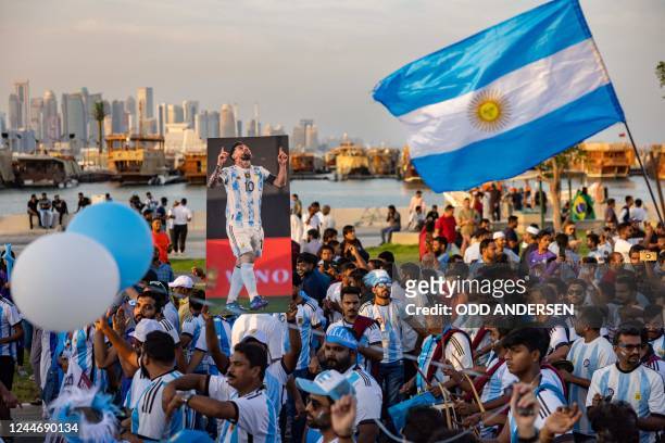 Football fans supporting Argentina cheer at a waterfront in Doha on November 11 ahead of the Qatar 2022 FIFA World Cup football tournament.