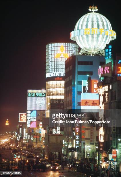 The skyline of Tokyo, Japan, at night, circa 1964.