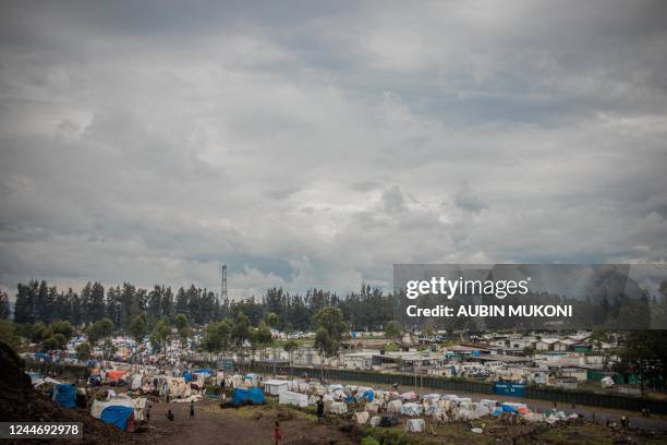 General view of makeshift structures set up by internally displaced people in Kanyaruchinya on November 11, 2022 after taking refuge there while...