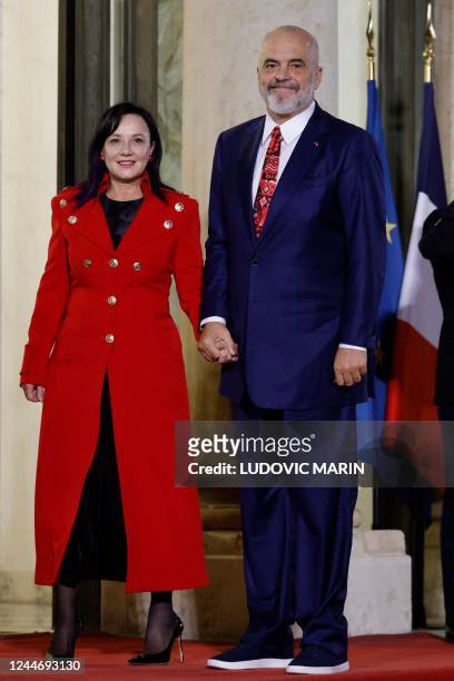 Albania's Prime Minister Edi Rama and his wife Linda Rama arrive for the Paris Peace Forum closing diner at the Elysee Palace in Paris on November...