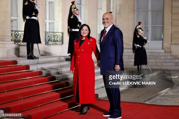Albania's Prime Minister Edi Rama and his wife Linda Rama arrive for the Paris Peace Forum closing diner at the Elysee Palace in Paris on November...