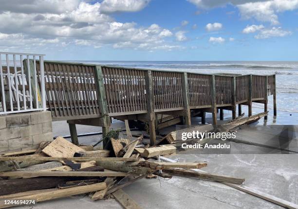 Debris is seen at a beach access ramp due to storm surge from Hurricane Nicole on November 11, 2022 in Daytona Beach Shores, Florida. Nicole made...