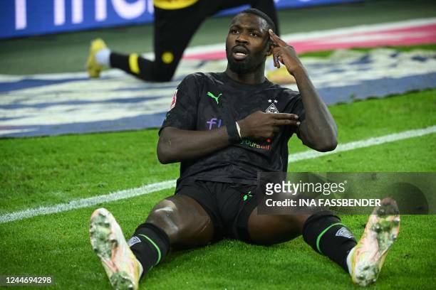 Moenchengladbach's French forward Marcus Thuram celebrates after scoring a goal during the German first division Bundesliga football match between...