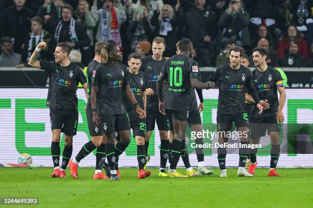 Marcus Thuram of Borussia Moenchengladbach celebrates after scoring his team's third goal with teammates during the Bundesliga match between Borussia...