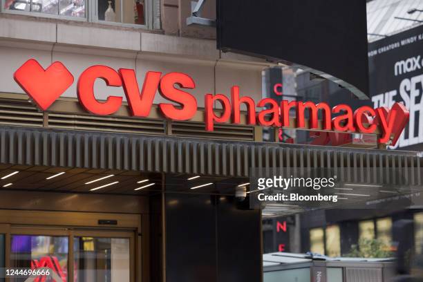 Signage outside a CVS Pharmacy store in New York, US, on Friday, Nov. 11, 2022. CVS Health Corp. Edged up its 2022 profit forecast as its insurance...