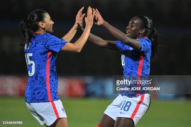France's forward Viviane Asseyi celebrates with France's midfielder Kenza Dali after scoring her team's second goal during the international friendly...
