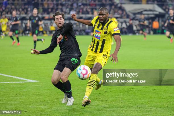 Joe Scally of Borussia Moenchengladbach and Anthony Modeste of Borussia Dortmund battle for the ball during the Bundesliga match between Borussia...