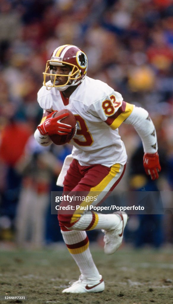 Ed Rubbert Washington Redskins wide receiver Ricky Sanders looks to gain yardage ...