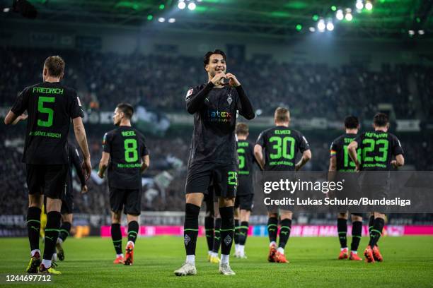 Ramy Bensebaini of Mönchengladbach celebrates after scoring his teams third goal during the Bundesliga match between Borussia Mönchengladbach and...