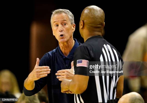 Head coach Steve Donahue of the Pennsylvania Quakers talks with referee Byron Jarrett during the first half against the Missouri Tigers at Mizzou...