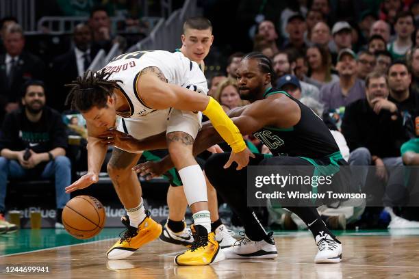 Noah Vonleh of the Boston Celtics tries to steal the ball from Aaron Gordon of the Denver Nuggets during the second half at TD Garden on November 11,...