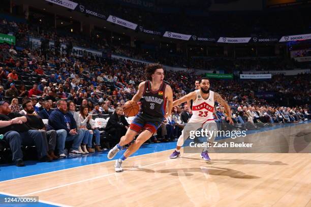 Josh Giddey of the Oklahoma City Thunder handles the ball during the game against the Toronto Raptors on November 11, 2022 at Paycom Arena in...