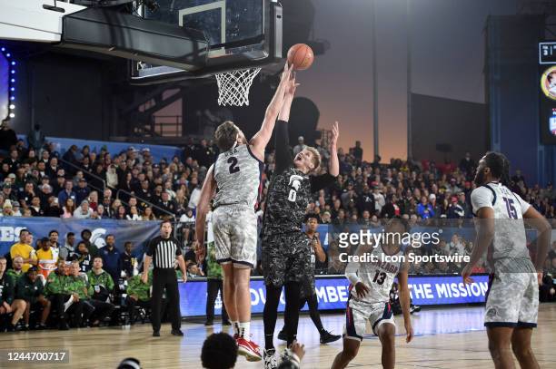 Michigan State Spartans forward Jaxon Kohler goes up for a shot over Gonzaga Bulldogs forward Drew Timme during the Armed Forces Classic Carrier...
