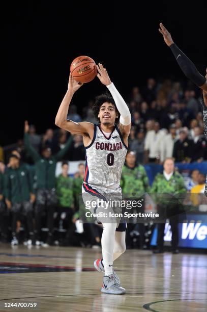 Gonzaga Bulldogs guard Julian Strawther passes the ball during the Armed Forces Classic Carrier Edition college basketball game between the Michigan...