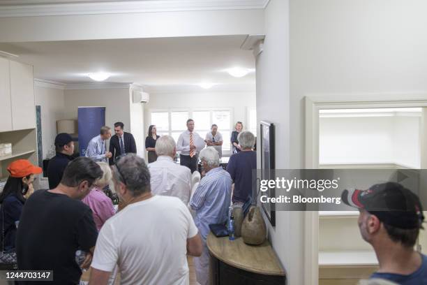An auctioneer, center, speaks to attendees at a residential home auction in the Rose Bay area in Sydney, Australia, on Saturday, Nov. 12, 2022....