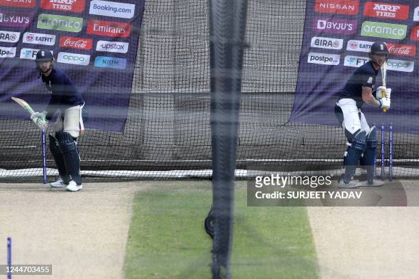 England's Captain Jos Buttler and Ben Stokes attend a net practice session at the Melbourne Cricket Ground in Melbourne on November 12 ahead of the...