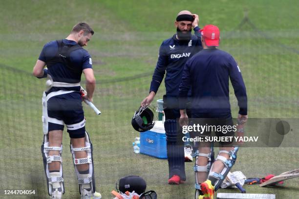 England's Moeen Ali and Chris Woakes prepare to bat during a net practice session at the Melbourne Cricket Ground in Melbourne on November 12 ahead...