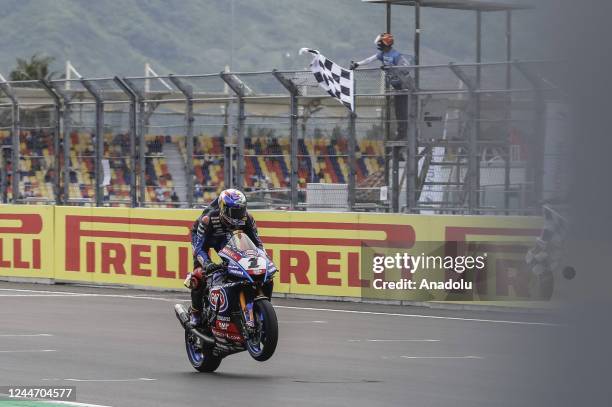 Turkish superbike rider Toprak Razgatlioglu of Yamaha Pata With Brixx celebrates after passing the finish line during Race 1 of Pirelli Indonesian...