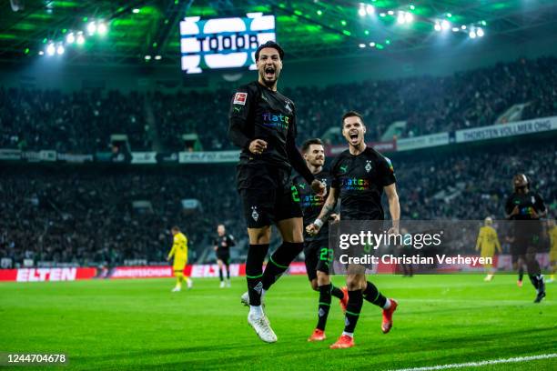 Ramy Bensebaini of Borussia Moenchengladbach celebrates after scoring his team's second goal during the Bundesliga match between Borussia...