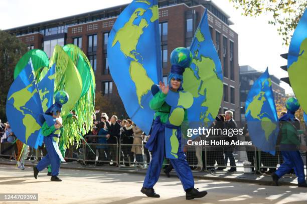 People participate in Lord Mayors Show parade on November 12, 2022 in London, England. The procession, which honours the new Lord Mayor of the City...