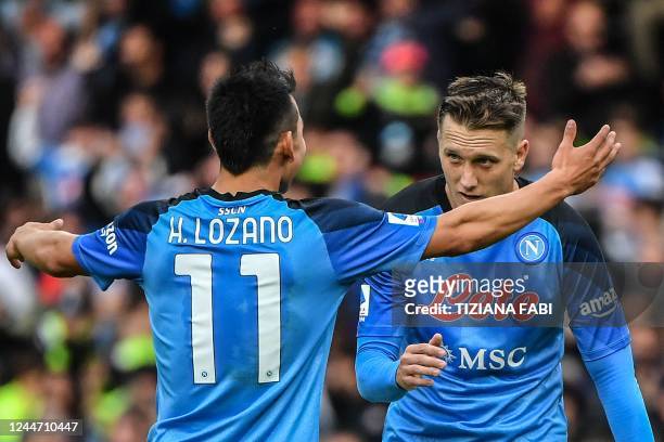 Napoli's Polish midfielder Piotr Zielinski celebrates after scoring his side's second goal during the Italian Serie A football match between Napoli...