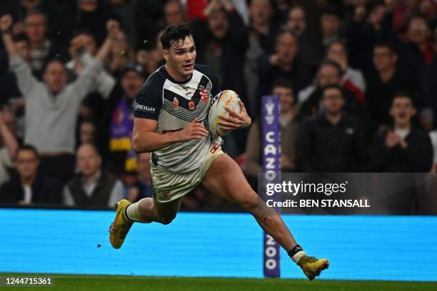 England's Herbie Farnworth scores a late try during the 2021 rugby league World Cup men's semi-final match between England and Samoa at the Emirates...