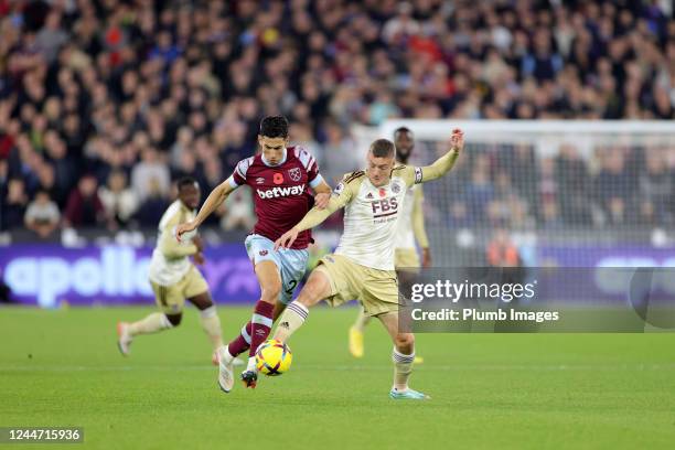 Jamie Vardy of Leicester City in action with Nayef Aguerd of West Ham United during the Premier League match between West Ham United and Leicester...