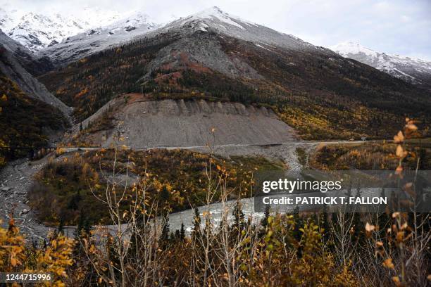 Workers repair train tracks on the Alaska Railroad from Anchorage to Fairbanks north of Denali National Park near Healy, Alaska on September 22, 2022.
