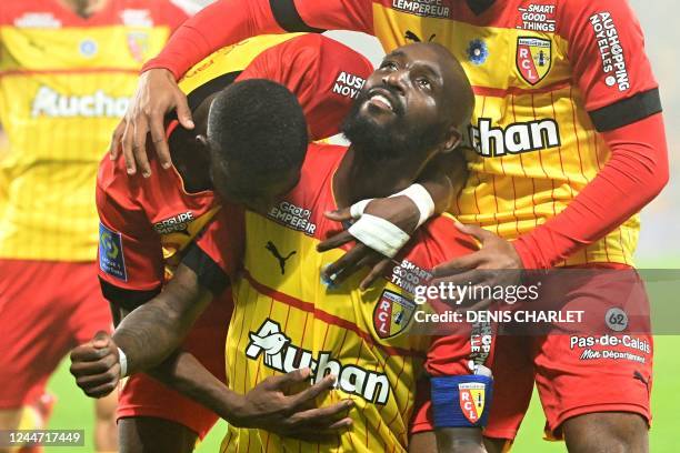 Lens' Franco-Ivorian midfielder Seko Fofana celebrates with teammates after scoring his team's second goal during the French L1 football match...