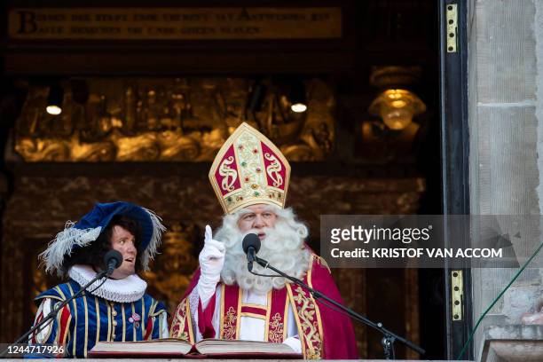 Zwarte Piet and Sinterklaas deliver a speech at the arrival of Sinterklaas in Antwerp, Saturday 12 November 2022. Sinterklaas is a tradition, mostly...