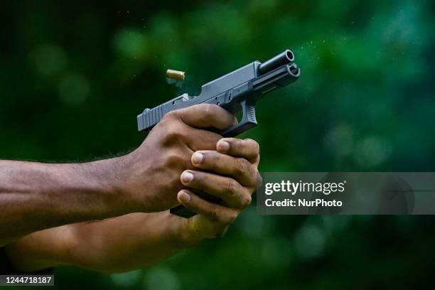 How the Glock 19 gun ejects its empty shell after firing on November 12, 2022 in Katukurunda, Sri Lanka. A Glock 19 pistol ejects its empty shell...
