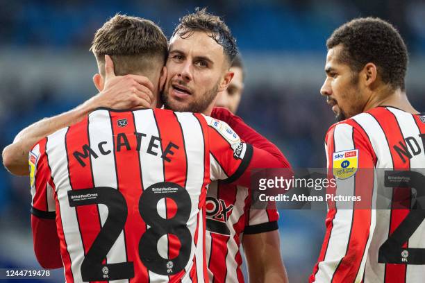 George Baldock of Sheffield United celebrates scoring with James McAtee during the Sky Bet Championship match between Cardiff City and Sheffield...