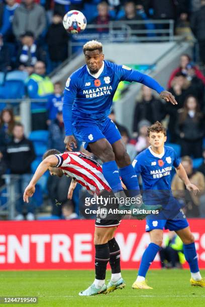Cedric Kipre of Cardiff City beats Billy Sharp of Sheffield United to a header during the Sky Bet Championship match between Cardiff City and...