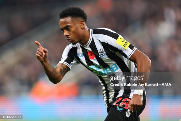 Joe Willock of Newcastle United celebrates after scoring a goal to make it 1-0 during the Premier League match between Newcastle United and Chelsea...