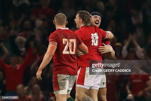 Wales' flanker Jac Morgan and Wales' prop Sam Wainwright celebrate the victory of their team at the end of the Autumn International rugby union...