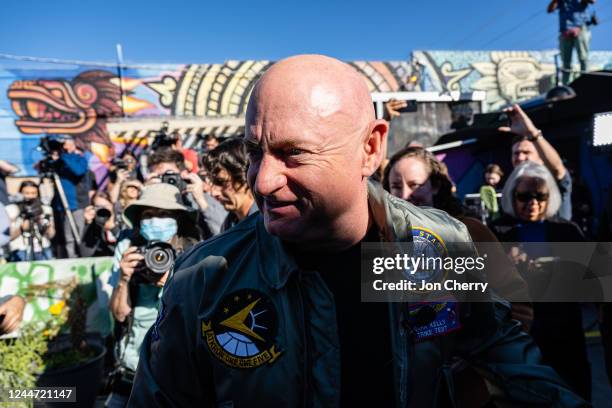 Sen. Mark Kelly smiles at his re-election celebration at Barrio Cafe on November 12, 2022 in Phoenix, Arizona. Kelly defeated his republican...