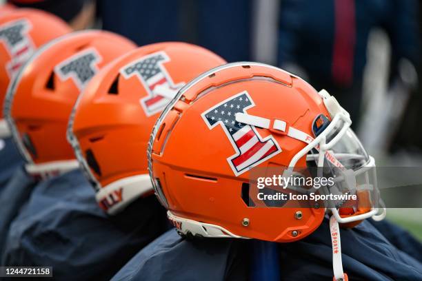 Playing helmets for some of the Illinois starters sits on warmers before the start of a Big 10 conference game between the Purdue Boilermakers and...