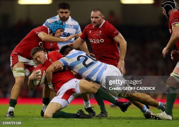 Wales' fly-half Rhys Priestland is tackled by Argentina's back-row Facundo Isa during the Autumn International rugby union friendly match between...