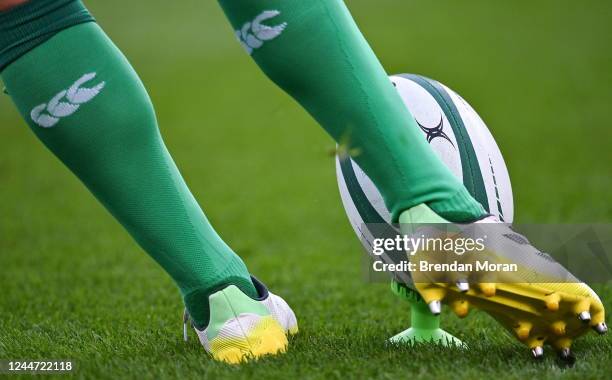 Dublin , Ireland - 12 November 2022; A player kicks a rugby ball on a kicking tee during the Bank of Ireland Nations Series match between Ireland and...