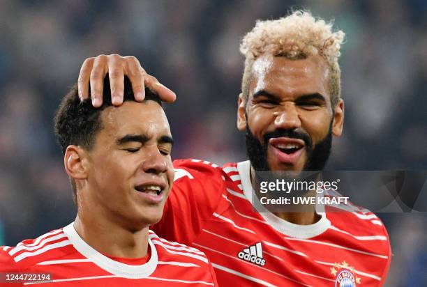 Bayern Munich's Cameroonian forward Eric Maxim Choupo-Moting reacts with Bayern Munich's German midfielder Jamal Musiala during the German first...