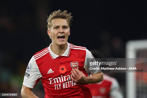 Martin Odegaard of Arsenal celebrates after scoring a goal to make it 0-1 during the Premier League match between Wolverhampton Wanderers and Arsenal...