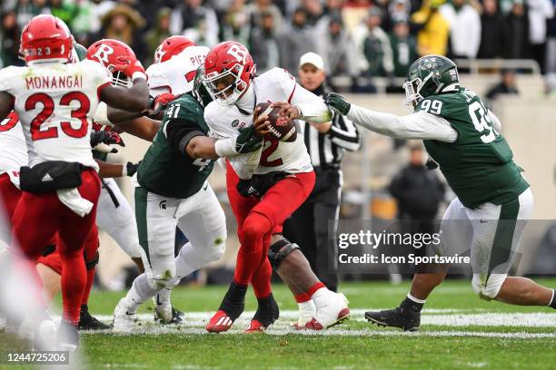 Rutgers Scarlet Knights quarterback Gavin Wimsatt attempts to step out of a tackle during a college football game between the Michigan State Spartans...