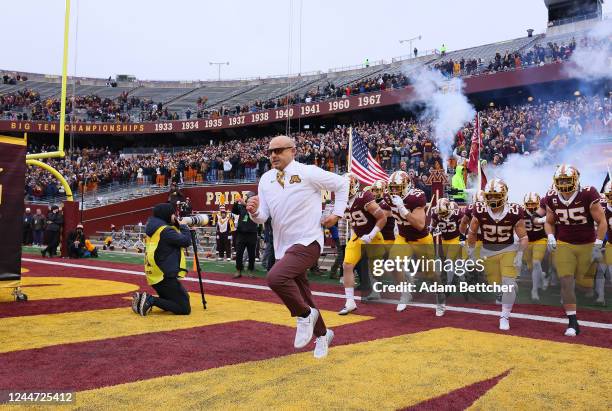 Head coach P.J. Fleck of the Minnesota Golden Gophers runs onto the field in the pregame against the Northwestern Wildcats on November 12, 2022 at...