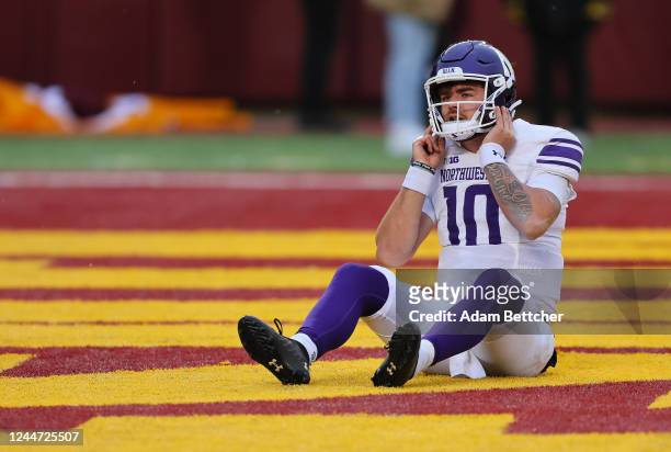 Brendan Sullivan of the Northwestern Wildcats sits in the end zone after being hit by the Minnesota Golden Gophers in the second quarter on November...