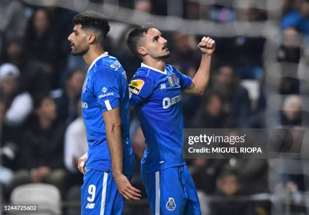 Porto's Canadian midfielder Stephen Eustaquio celebrates scoring his team's second goal next to FC Porto's Iranian forward Mehdi Taremi during the...